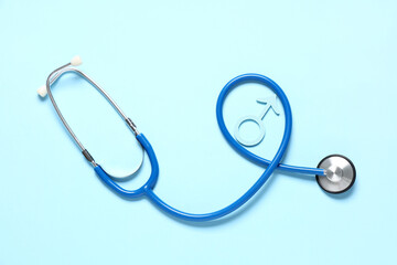 Male sign with stethoscope on blue background. Prostate cancer awareness concept