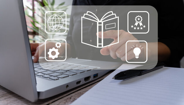 Online teaching: person pointing at a virtual screen with various e-learning-related icons