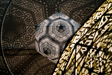 Lantern's Shadowy Geometric Embrace