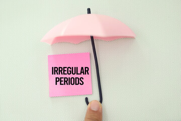 paper board and stickers with the word irregular periods. if the gap between them is less than 21 days or more than 35 days