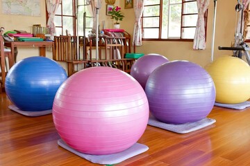 Colorful exercise balls in a room