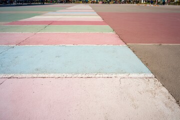 Multi-colored pavement stripes in a park