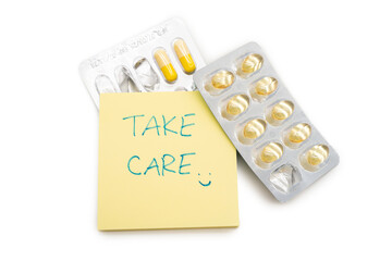 Take Care Note with Pills and Capsules Blister Packs. Health, self care, and remembering to take...