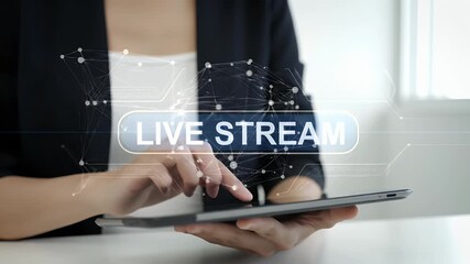 Woman Interacting with Live Stream Displayed on a Digital Tablet in a Bright Room with Abstract Geometric Overlay