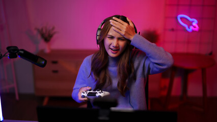 Young Asian Woman Gamer Expresses Stress Frustration Emotion While Playing Video Game At Home