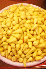 Freshly prepared yellow corn kernels on a plate