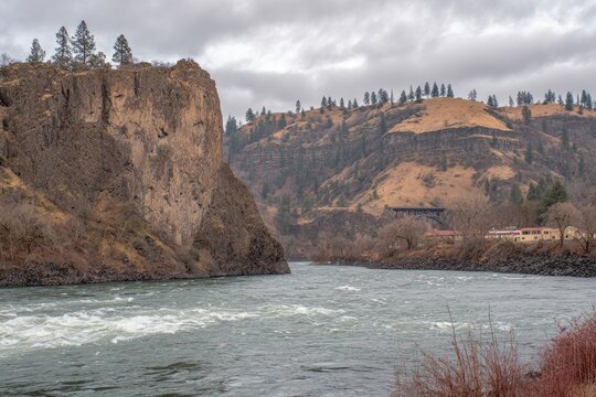 Rocky river canyon, cloudy sky