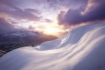 Snowy mountain peaks at sunset