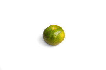 A fresh Thai green tangerine, isolated on a clean white background. This realistic shot, with its soft shadow, is perfect for exotic food, travel, and wellness content. An authentic, vibrant choice.