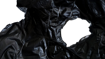 Wrinkled texture of black plastic with ripped hole isolated on transparent background