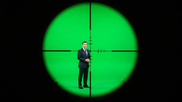 Businessman in Suit Posed in Front of Green Screen