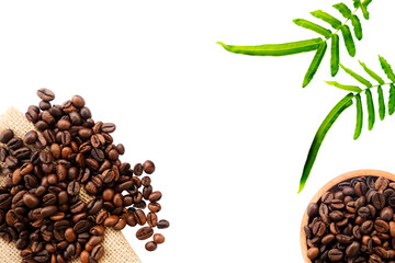 frame made of roasted coffee beans with decoration leaves on white background isolated