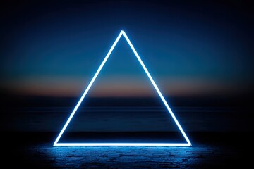 Neon blue triangle frame on a beach at night