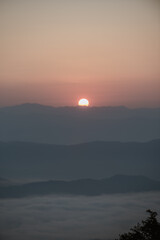 Sunrise on the top of a high mountain.