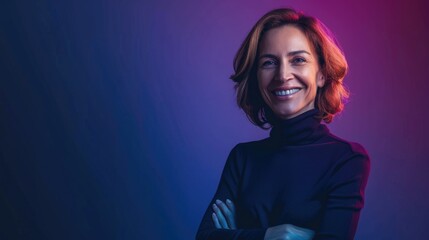 Portrait of a businesswoman smiling with her arms crossed in office, purple neon light blurred background.