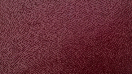 Fototapeta premium Close up of a textured dark crimson red surface with subtle gradient and fine grain detail creating a rich and luxurious background