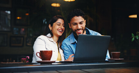 Laptop, coffee and couple in cafe with laugh, bonding or talking on morning date together. Happy,...
