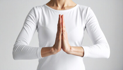a yoga practitioner's hands in prayer position, centered against a neutral background. Minimalist style with calm energy, symbolizing balance, mindfulness, and inner peace