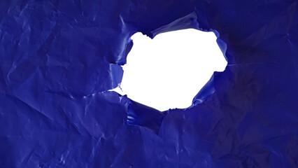 Crumpled purple plastic with ripped hole in the middle of the surface isolated on transparent...
