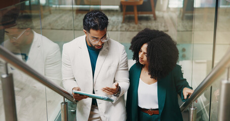 Teamwork, stairs or business people with tablet for feedback, investment research or budget. Collaboration, walk or financial advisor in office lobby for news, accounting deadline or finance report