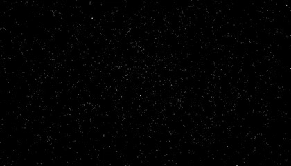 A dark black background covered in a fine, speckled texture of subtle white noise or dust particles