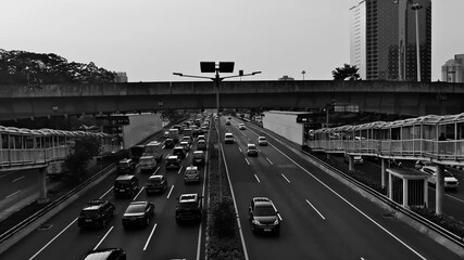  city street traffic in Black and white video. urban activity and life monochrom focus.Cars, pedestrians, trolleybuses   - Powered by Adobe