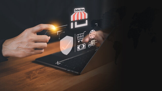 Customer holding a credit card while using a laptop with virtual shopping icons. Business concept of secure online transactions, e-commerce, digital payments, and modern financial technology systems.