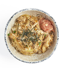Bowl of Japanese oyakodon, featuring tender chicken, egg, and onions simmered in savory sauce, served over steamed rice and garnished with shredded nori and pickled ginger