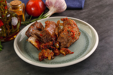 Baked beef ribs with vegetables