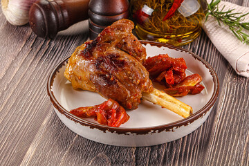 Baked lamb shank with vegetables