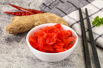 Marinated ginger root in the bowl
