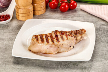 Grilled pork loin steak with bone