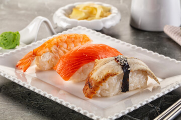Japanese cuisine - sushi with eel, salmon and prawn