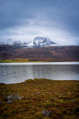 Landscape view of Iceland with snow peak mountain river and golden field in autumn season for travel by road trip.
