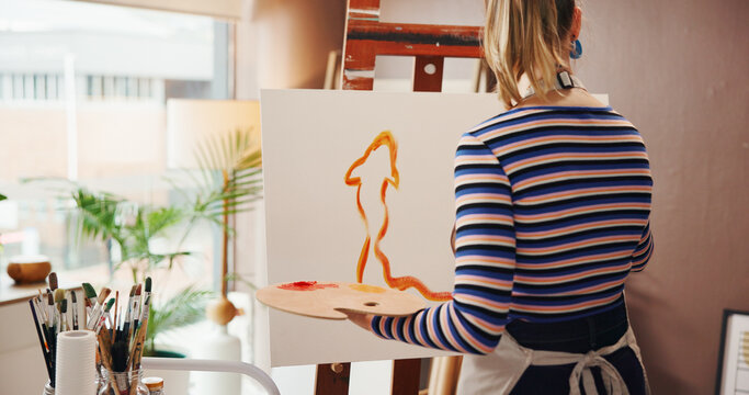 Art, back and painting with woman in studio apartment for creative expression or illustration hobby. Easel, palette and talent with painter in home for drawing, inspiration or picture on canvas