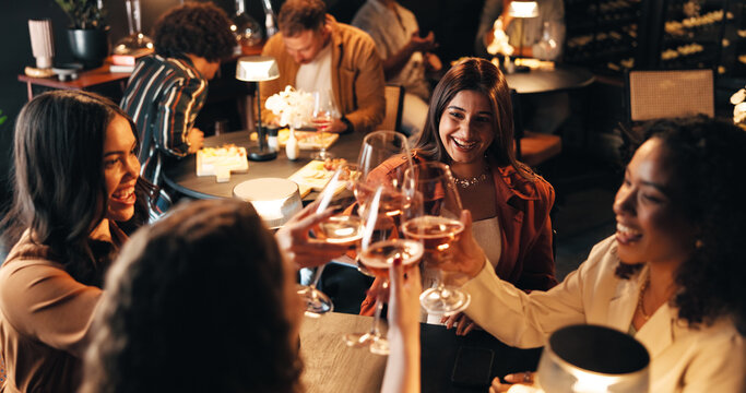 Happy women, friends and night with cheers in restaurant for celebration, toast or get together. Female people, group or evening out with wine glasses, drink or alcohol for social gathering or event