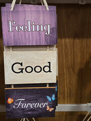 A wooden motivating tablet on the rack says 