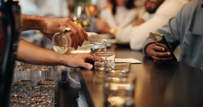 Counter, alcohol and hands of waiter with glass for customer service, order and hospitality. Nightclub, pub and bartender pour drinks, beverage and liquid for serving people at bar in happy hour - Powered by Adobe