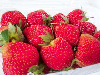 Fresh red strawberries isolated on a white background.