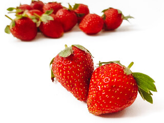 Fresh red strawberries isolated on a white background.
