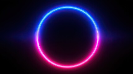 Obraz premium Neon circle of vibrant pink and blue light on a black background.