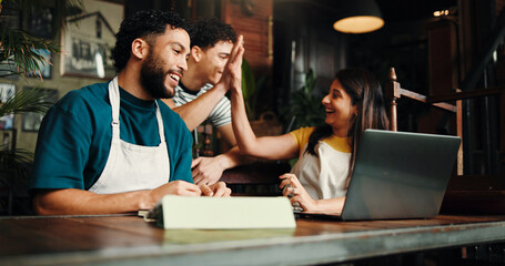 Happy people, team and laptop with high five in cafe for small business success together. Group,...