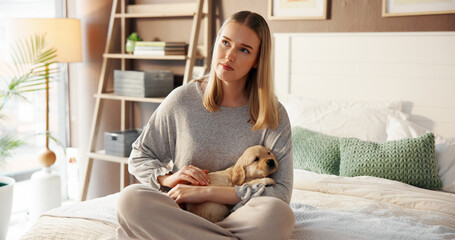 Thinking, woman and relax with puppy in bedroom for love, care and bonding together with companion....