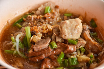 The closed up of Thai noodles with meat ball. Select and soft focus.