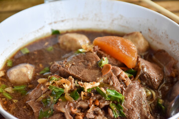 The closed up of Thai noodles with meat ball. Select and soft focus.