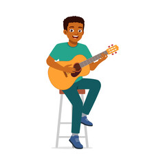 Happy African American Man Plays Acoustic Guitar Seated on Stool Indoor