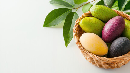 Assorted exotic fruits in woven basket, showcasing vibrant colors and fresh leaves, evoke sense of abundance and nature