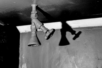 Old Shower Head or Sprinkler in a Dark Bunker