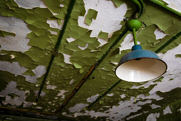 Abandoned Industrial Lights on Peeling Walls