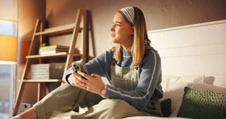 Phone, smile and thinking with girl in bedroom of home for college or university communication....